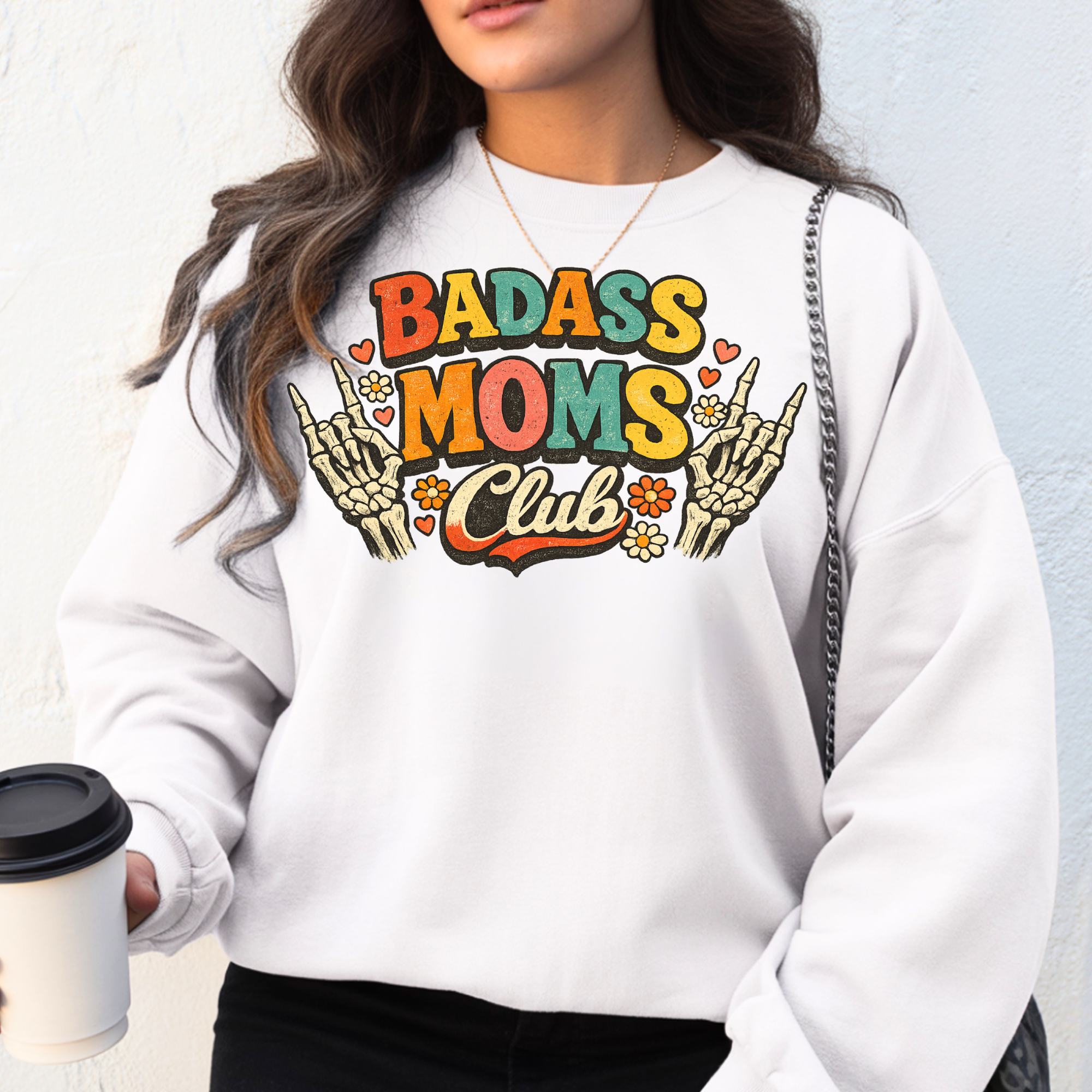 badass moms club sweatshirt with colorful graphic text worn by woman holding coffee, trendy mom outfit, Mamamuse Studio