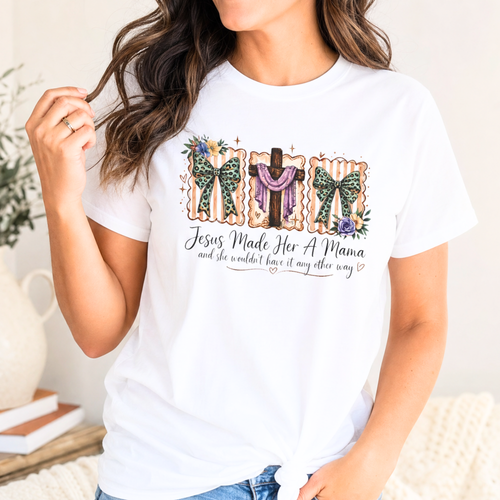 Christian mama t shirt featuring Jesus Made Her A Mama quote with floral bows and cross design on white shirt.