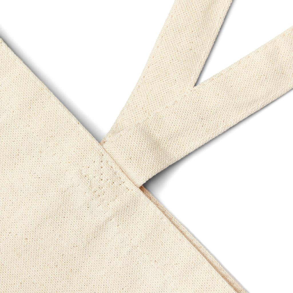 Close-up of cotton canvas owl tote bag showing durable fabric texture and sturdy shoulder straps for everyday use
