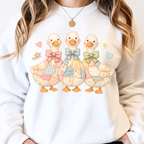 Close up of cute duck faux patchwork design with bows and floral details on aesthetic sweatshirt