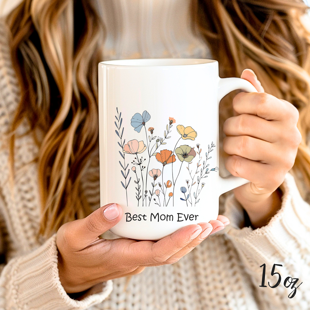 Close-up of hands 15oz holding cute mom mug with floral design