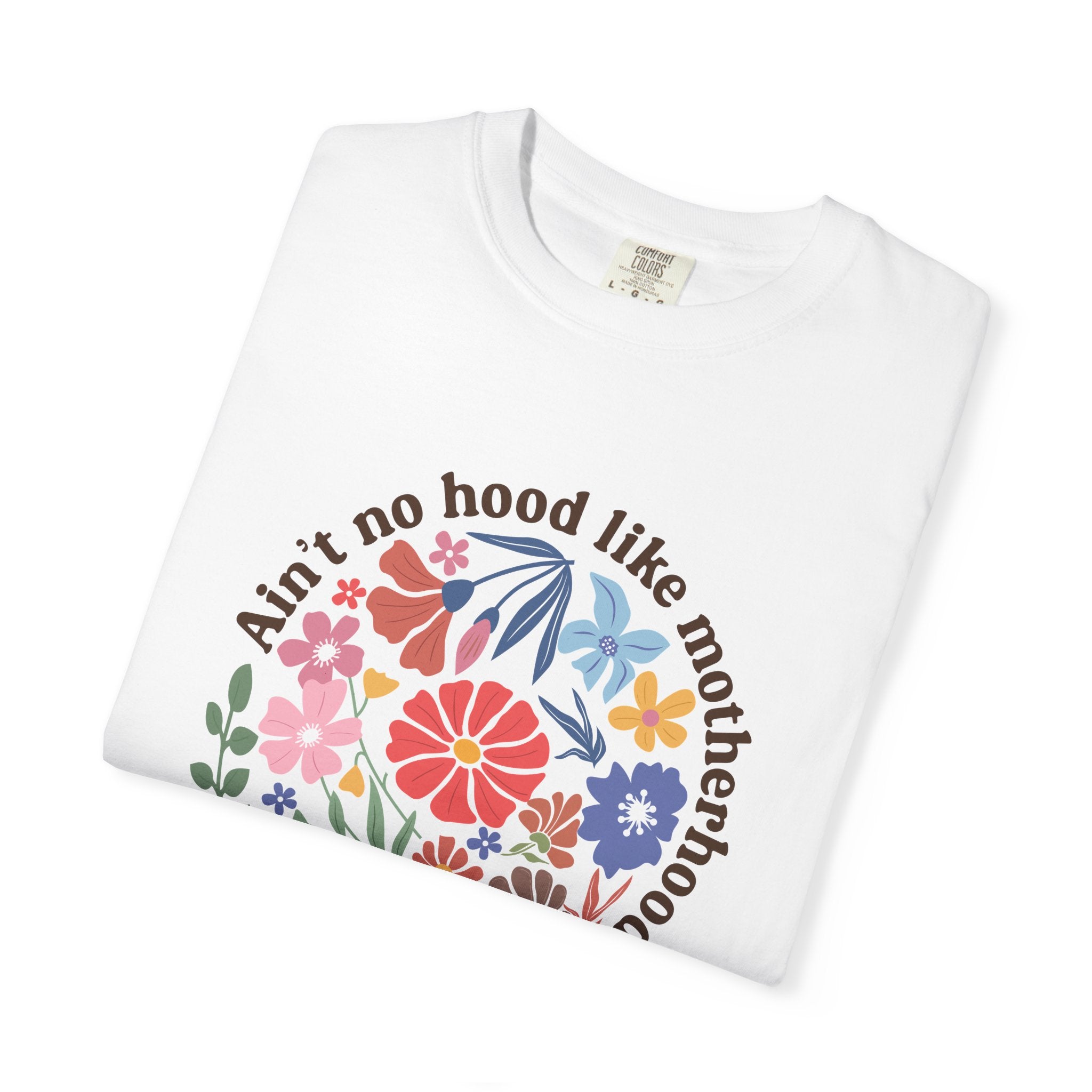 Motherhood graphic t shirt with colorful floral artwork and funny motherhood quote on white cotton tee.