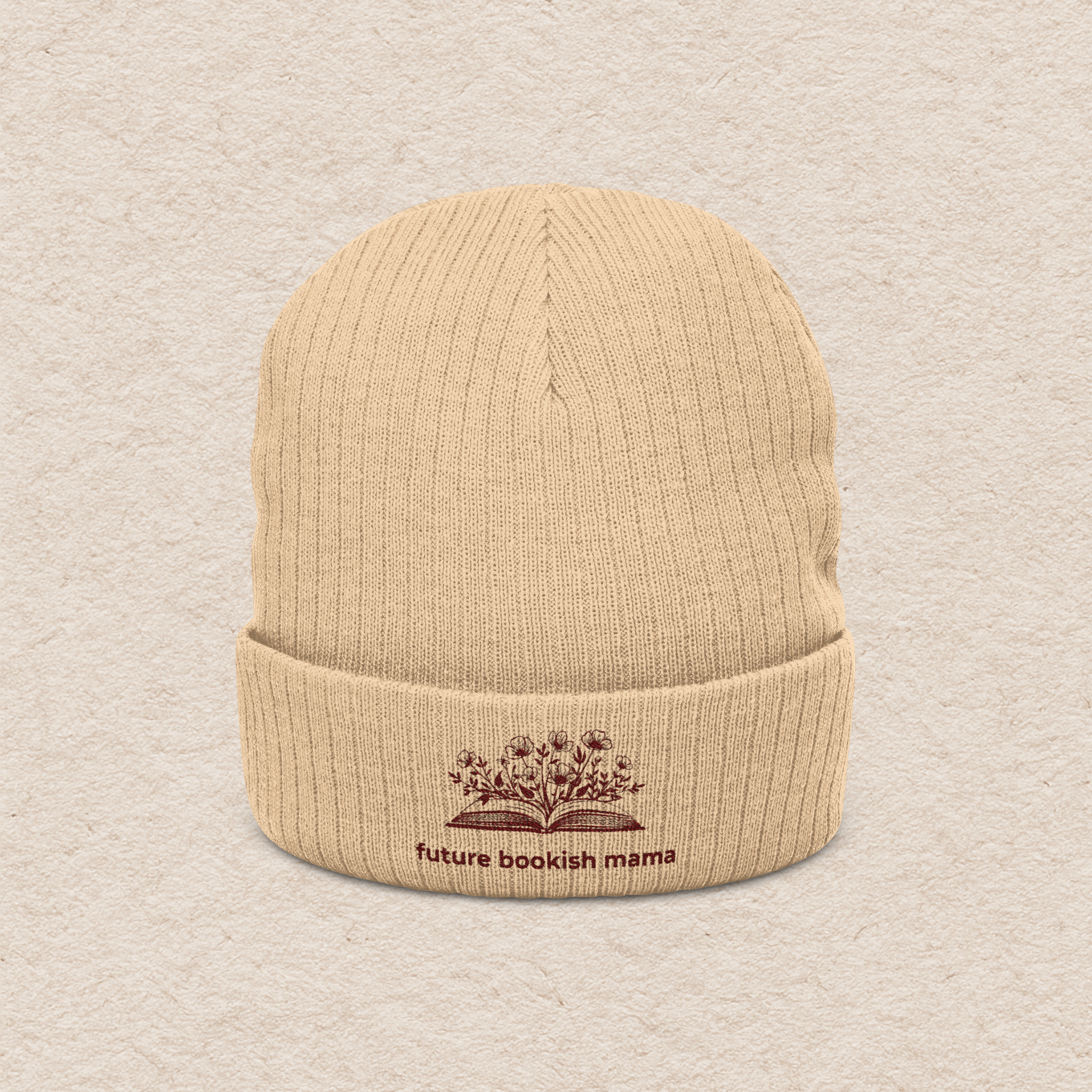 Front view of beige embroidered “Future Bookish Mama” beanie with book design, cozy winter hat for moms