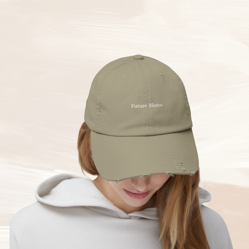 Woman wearing olive distressed Future Mama baseball cap, casual maternity outfit style