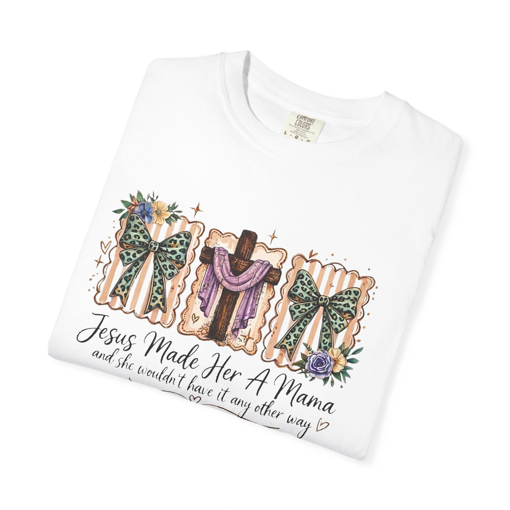 Christian mama graphic tee displaying floral bow artwork, cross illustration, and inspirational faith message.