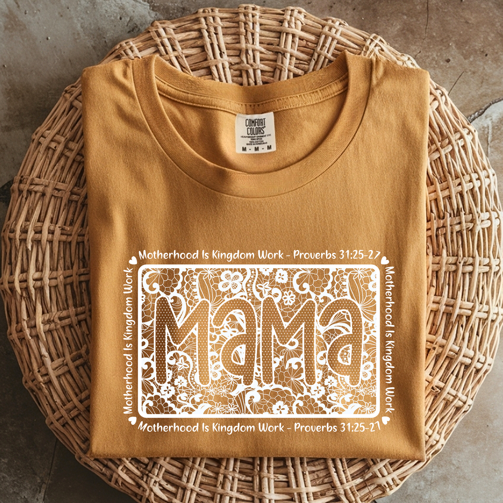 Folded mustard Comfort Colors mama shirt with lace floral graphic and Proverbs 31 Christian motherhood message.