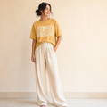 Woman wearing mustard Comfort Colors lace trimmed mama shirt featuring Proverbs 31 scripture and vintage floral Christian mom design.