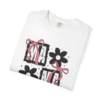 White mama bow floral graphic t shirt with pink ribbon bows and floral artwork displayed flat.