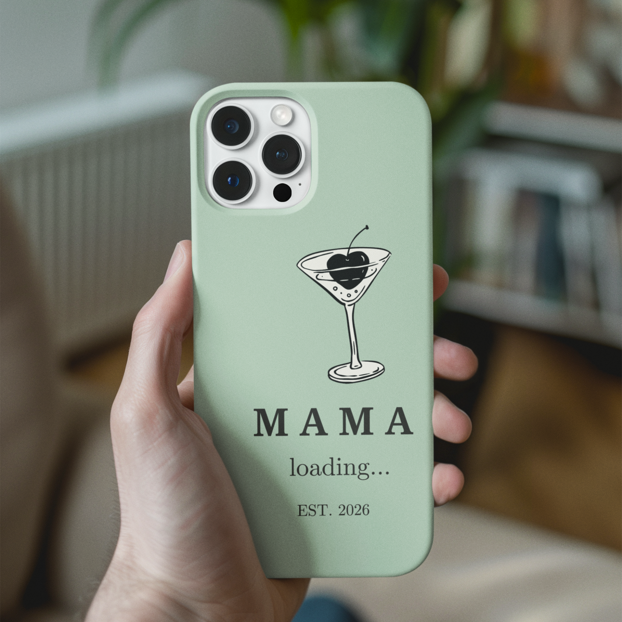 Aesthetic sage green MAMA loading est 2026 pregnancy announcement iPhone case held in hand