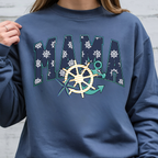 Close-up of Denim Mama Nautical sweatshirt featuring ship wheel, anchor, starfish, and coastal-inspired artwork.
