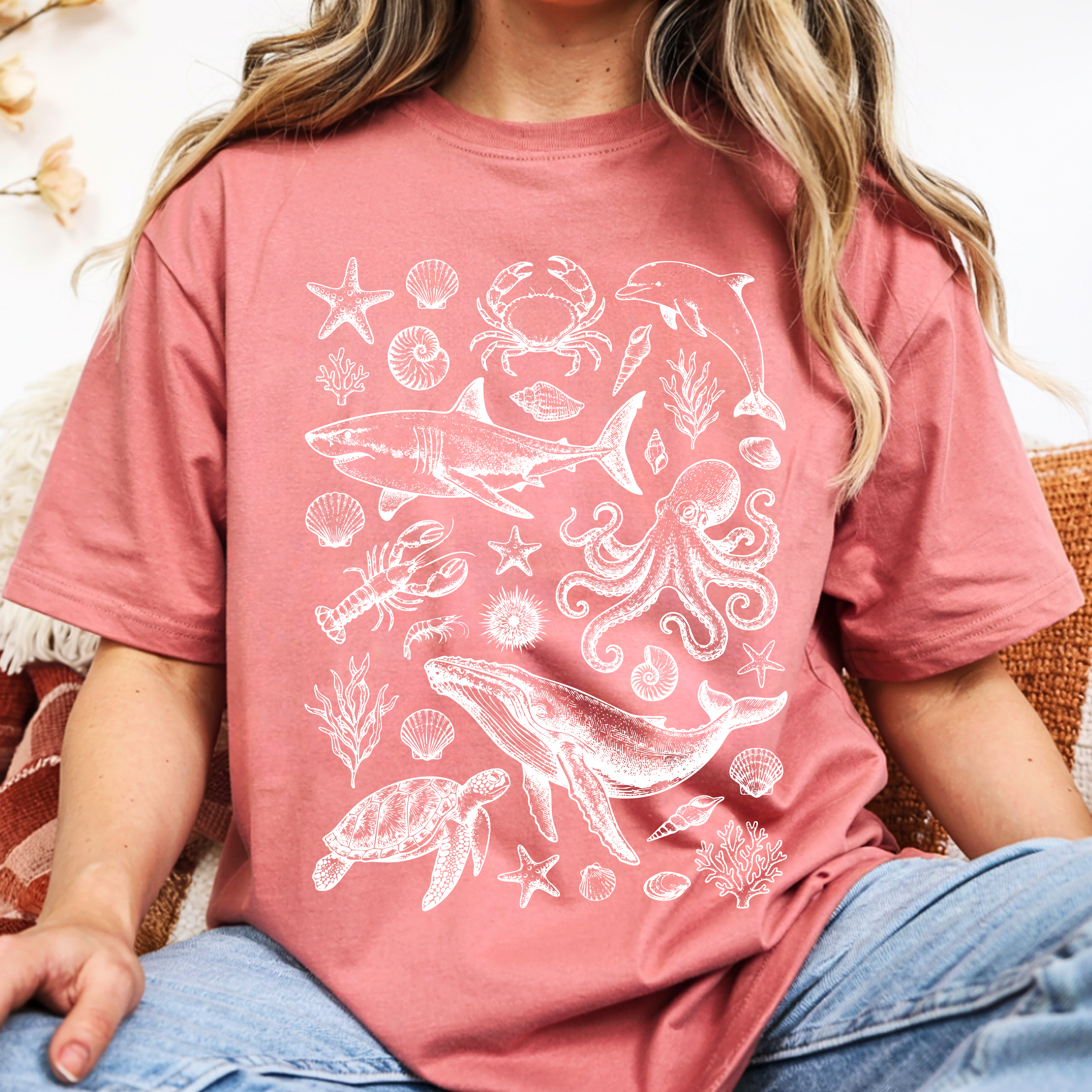 Close-up view of Ocean Life graphic design featuring whale, dolphin, octopus, sea turtle, shells and coral artwork.