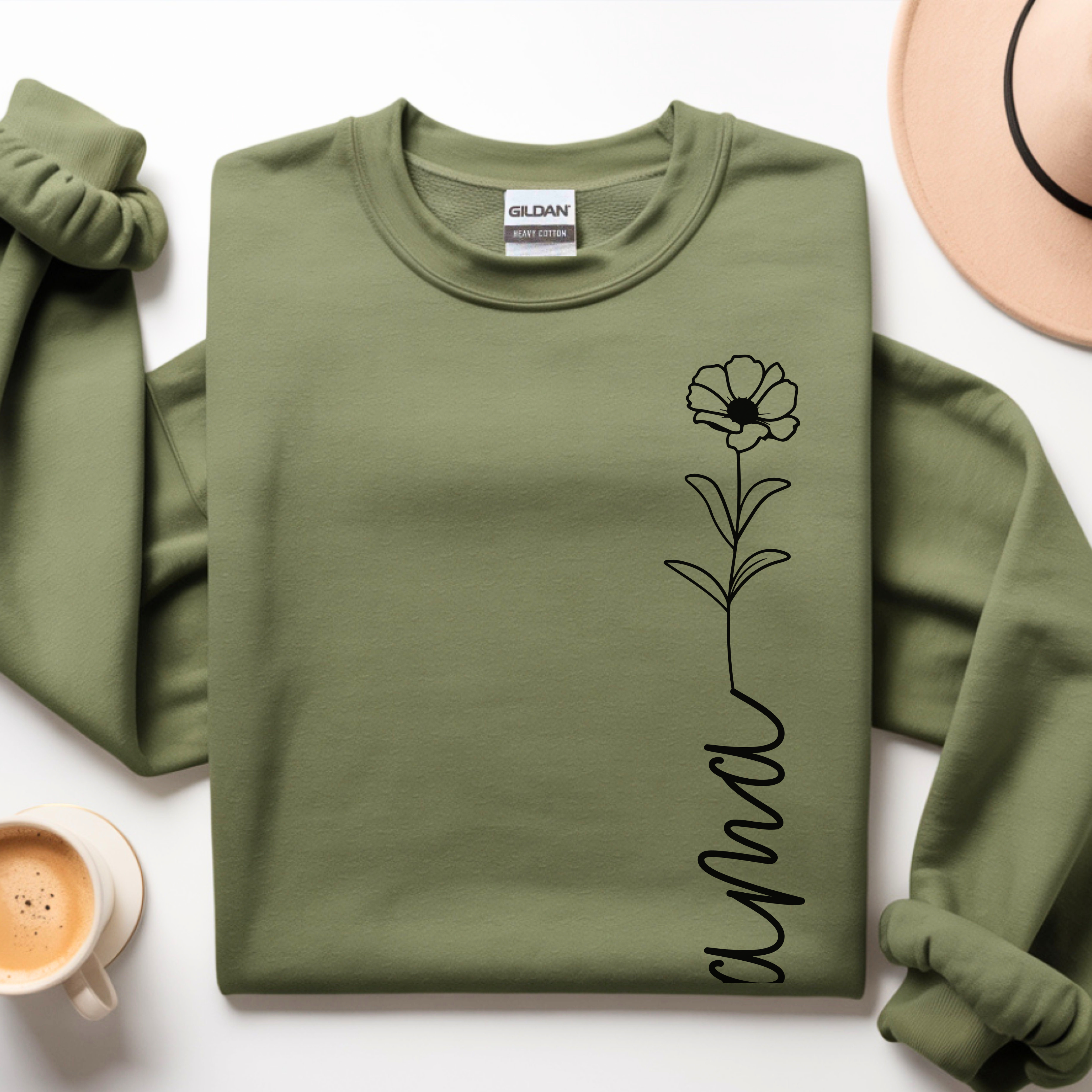 Close-up of minimal mama floral design on sweatshirt, delicate line art detail