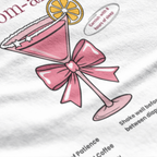 Close up of Mom-arita martini glass graphic with pink bow on t-shirt