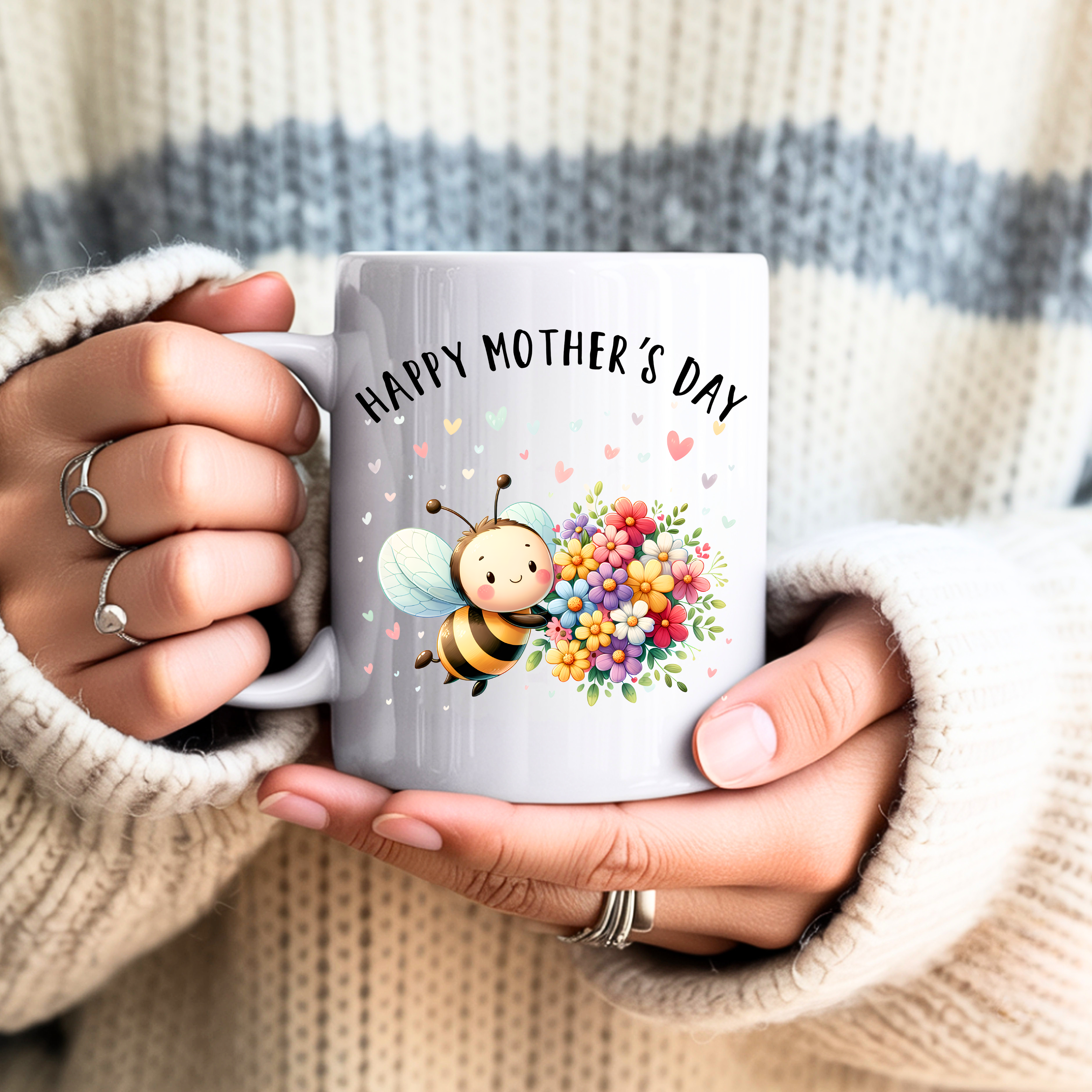 Hands holding Mother’s Day bee mug cozy gift for mom