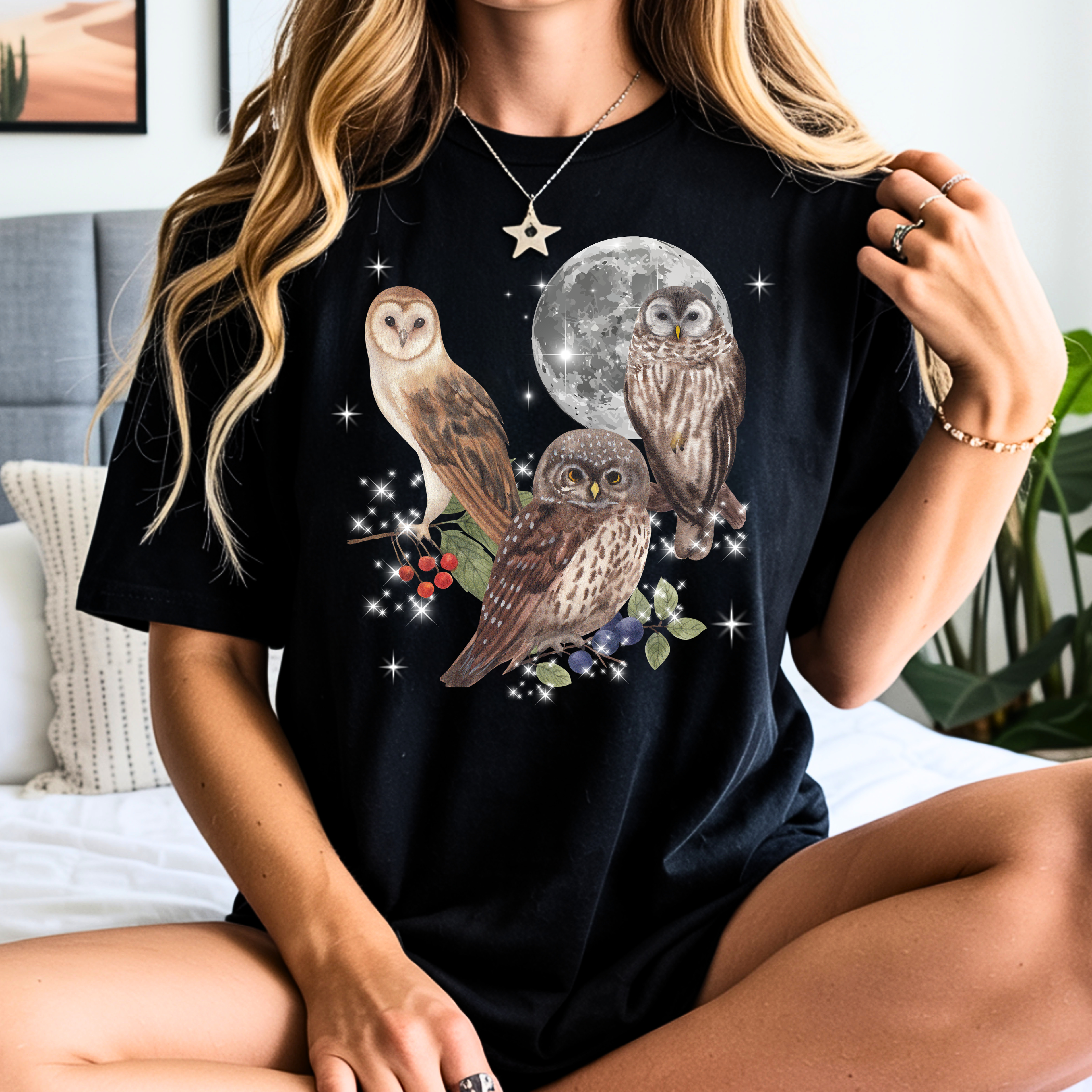 Black owl graphic t-shirt featuring three owls under a moonlit sky, perfect for owl lovers, bird enthusiasts, and nature lovers.