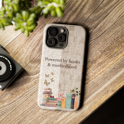 Motherhood themed phone case with books illustration placed on wooden table, perfect gift for reading moms
