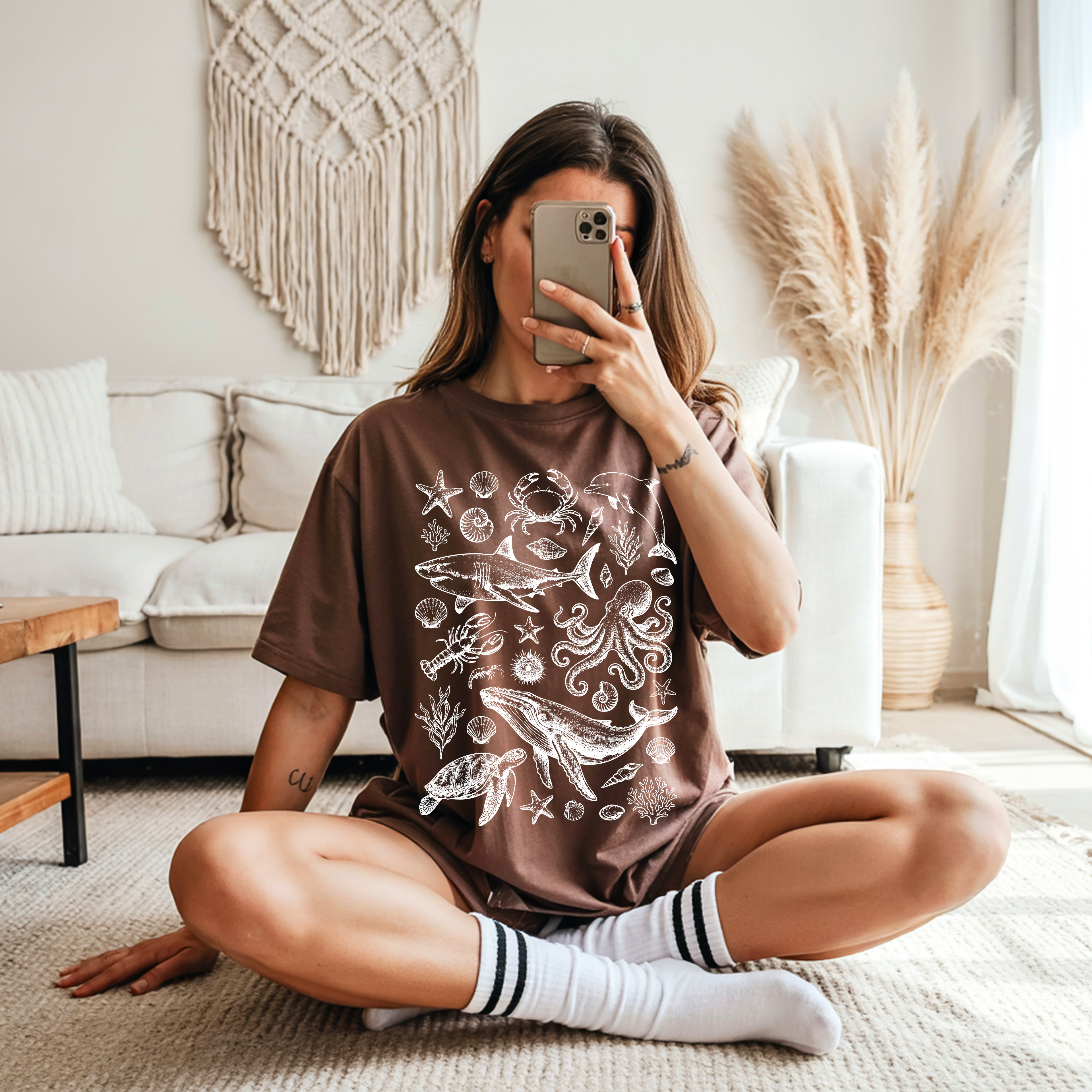Relaxed fit Ocean Life graphic tee featuring coastal marine animals including whales, dolphins, octopus and sea turtles.