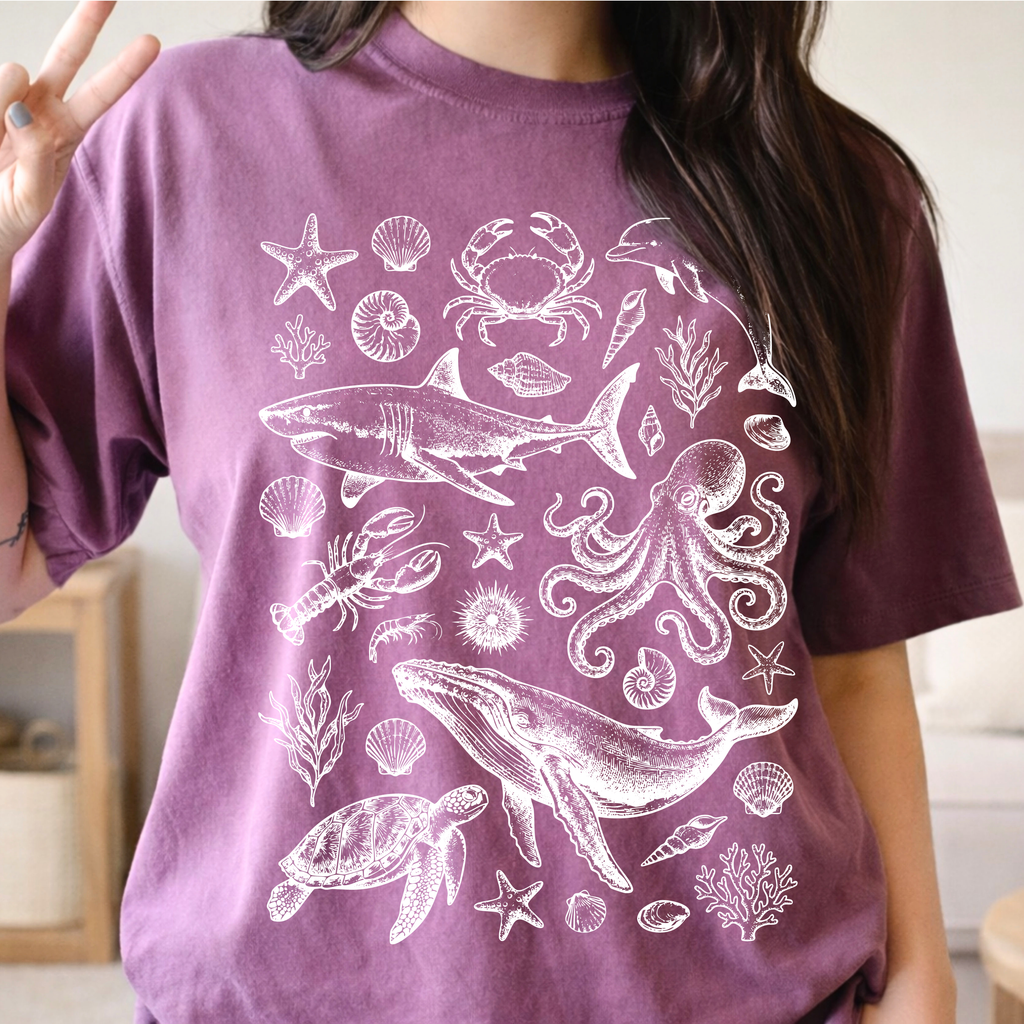 Berry colored Ocean Life graphic tee featuring coastal marine life illustrations and vintage beach aesthetic.