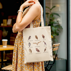 Woman carrying aesthetic owl tote bag with cotton canvas, perfect for daily use, shopping, and casual outfits
