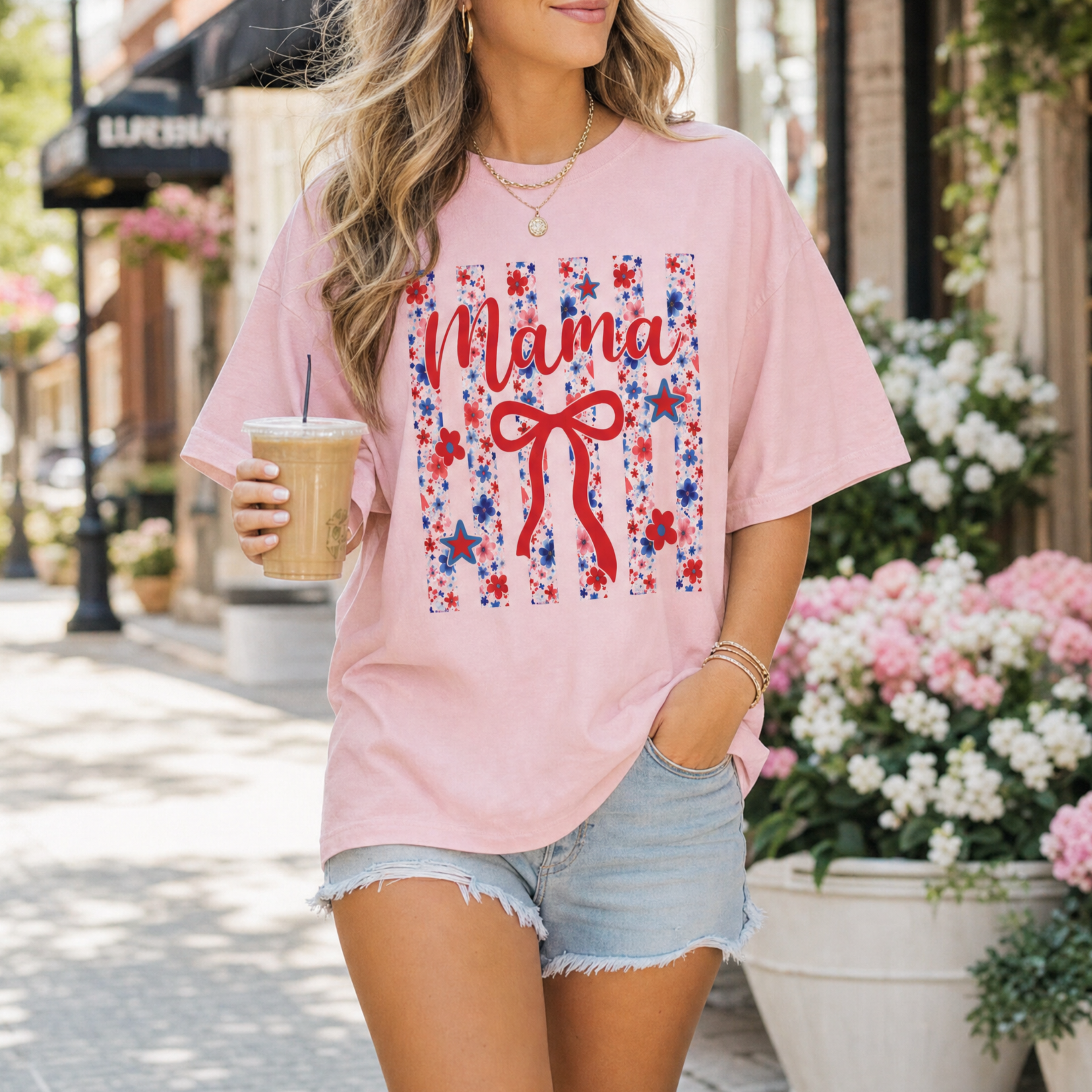 Woman wearing Blossom pink Patriotic Mama t-shirt with floral bow design
