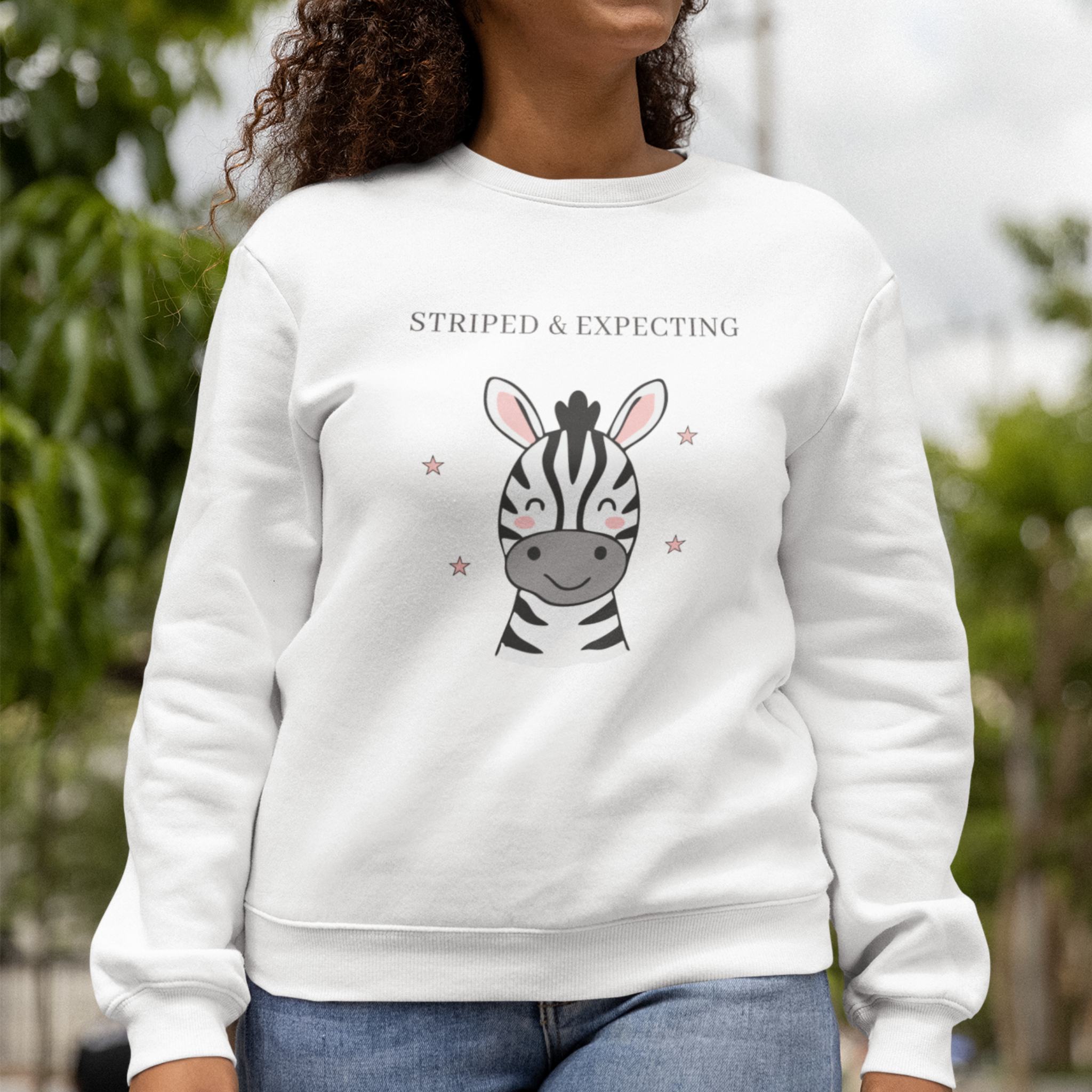 Pregnant woman wearing Striped and Expecting zebra maternity sweatshirt in white cozy crewneck for expecting moms
