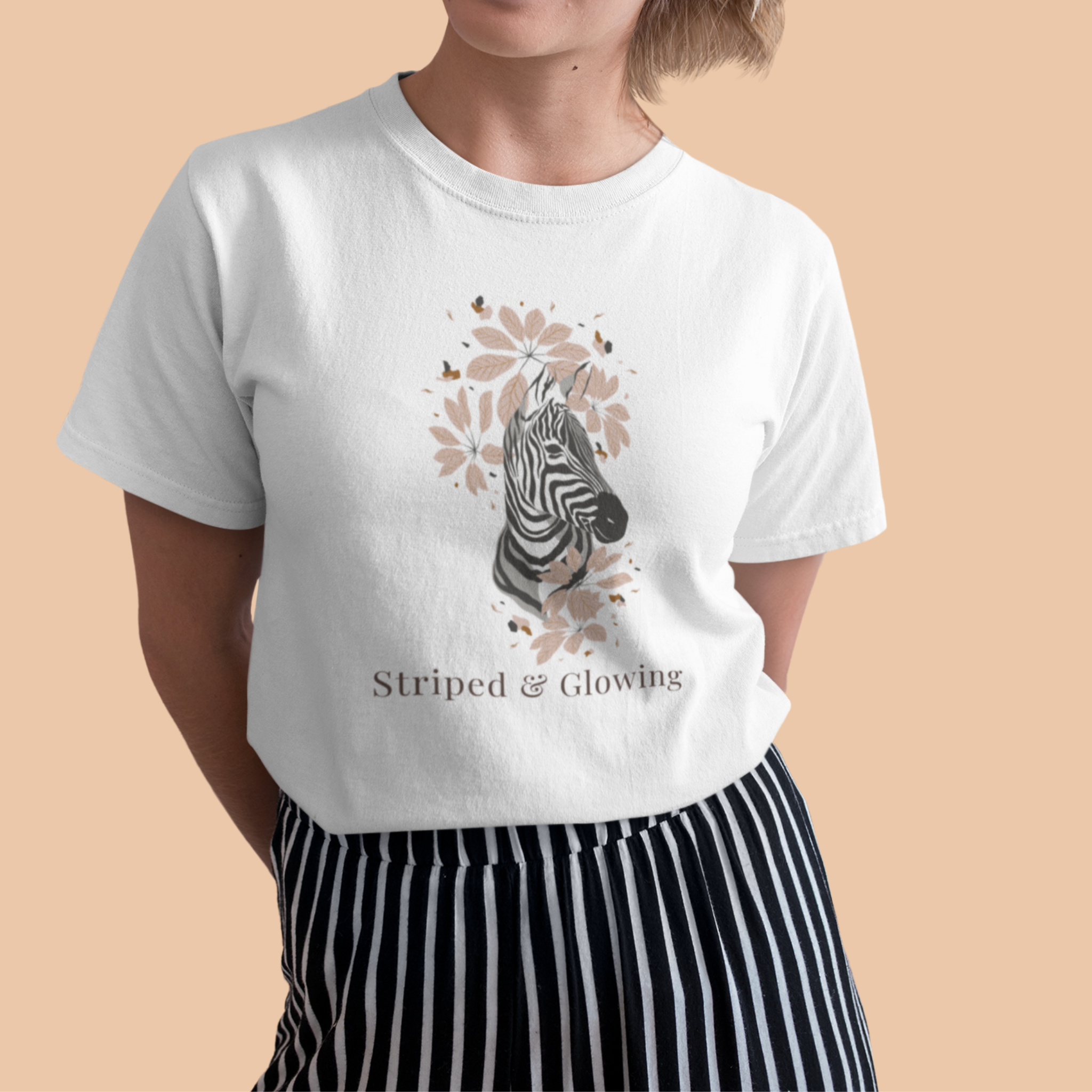 Pregnant woman wearing white Striped and Glow maternity t shirt with zebra floral design cute pregnancy shirt for expecting mom