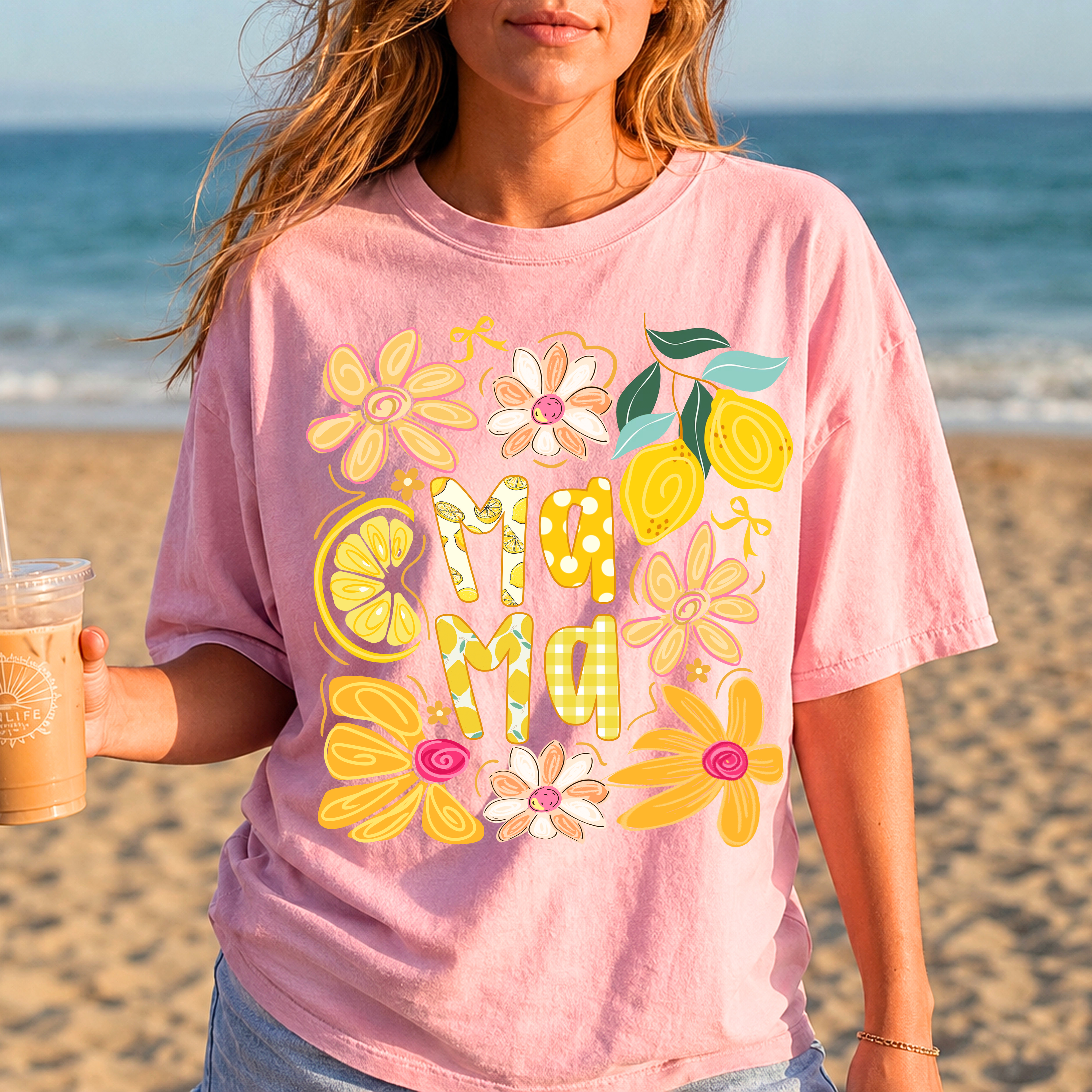 Blossom pink Summer Mama graphic tee with retro floral artwork, styled for beach vacations and summer mom fashion.