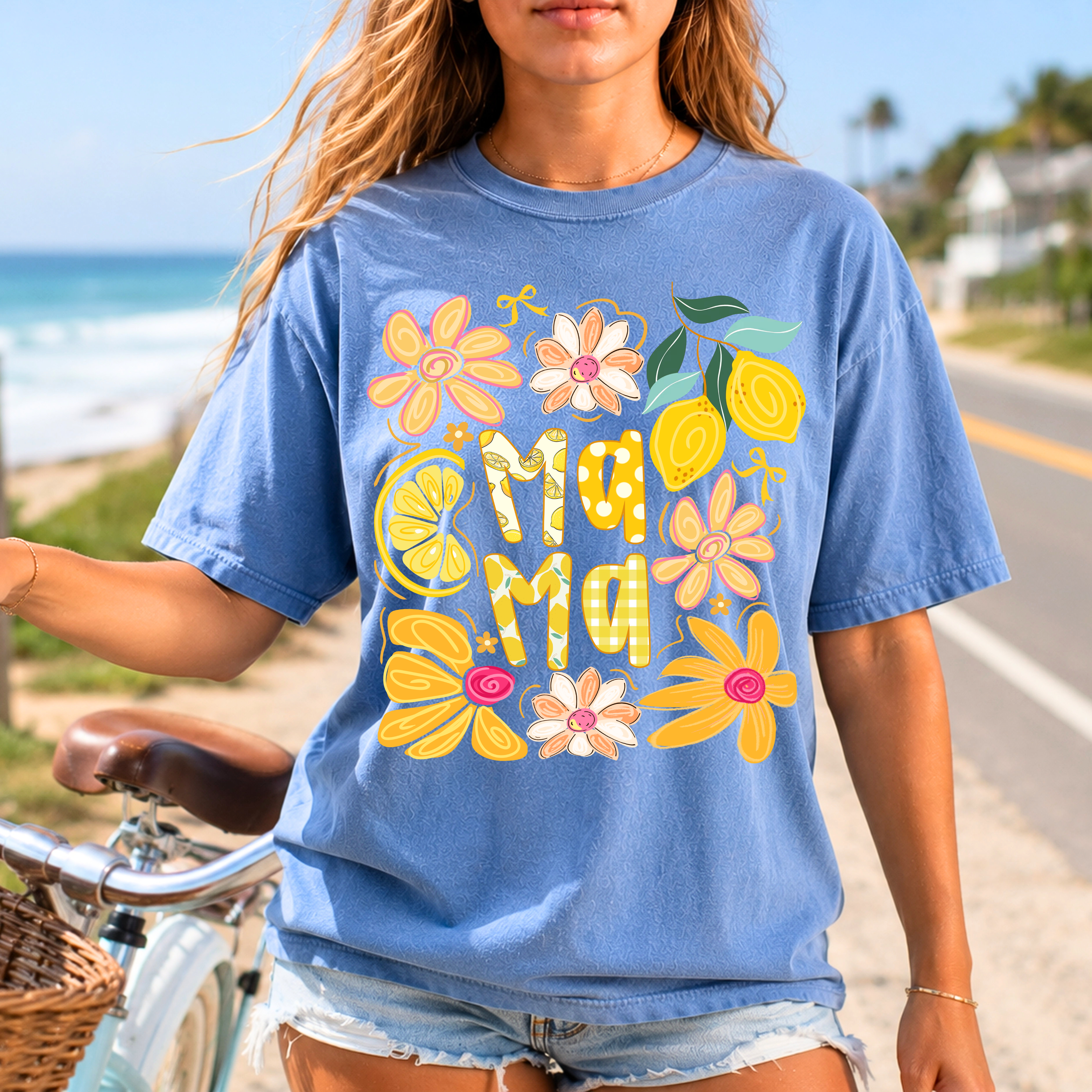 Blue Jean Summer Mama graphic t-shirt with colorful flower and lemon print, perfect for beach days and casual mom style.