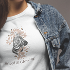 Close up of zebra floral artwork on Striped and Glow maternity t shirt stylish pregnancy graphic tee